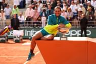 Rafael Nadal with the 2022 men's singles French Open trophy.